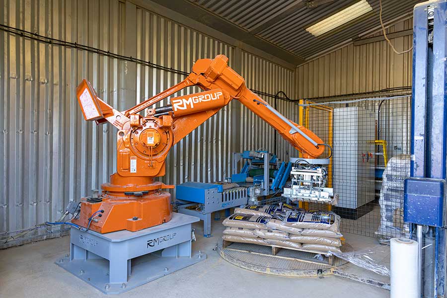 New robot by RM Group packs small bags of sand at AWBS