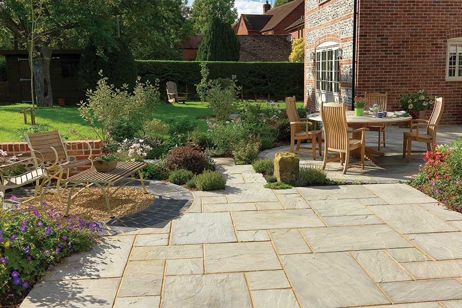 Light grey classic sandstone patio is a contender for the best patio paving