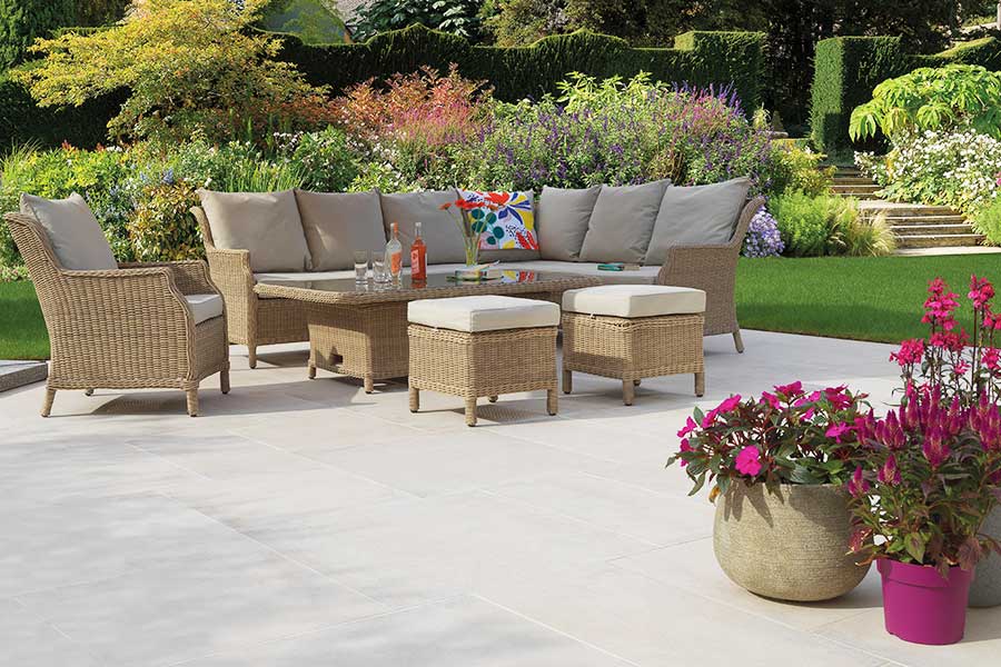 Stunning large patio featuring Pavestone Opus light porcelain paving tiles