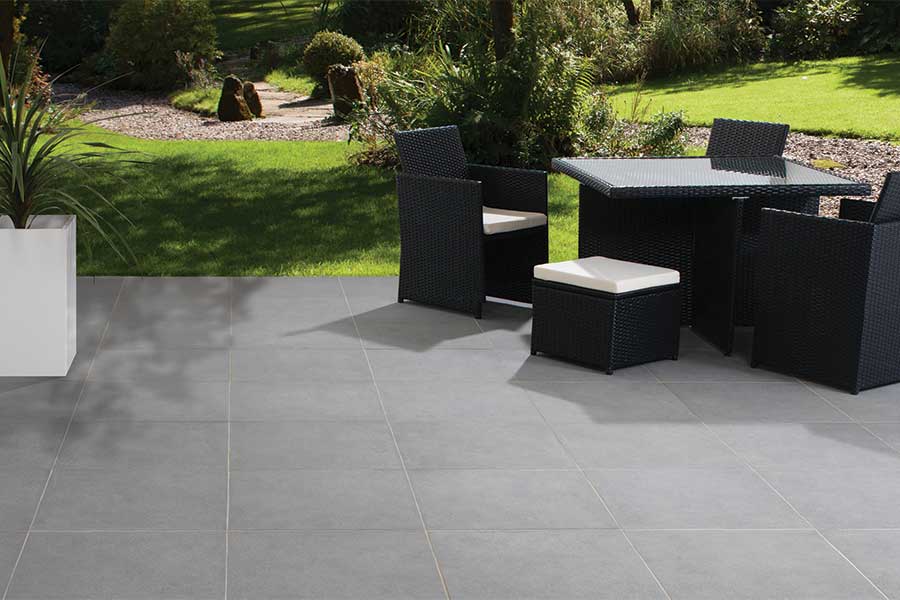 Modern sunken patio paved with grey Bradstone Mode sparkle effect porcelain paving