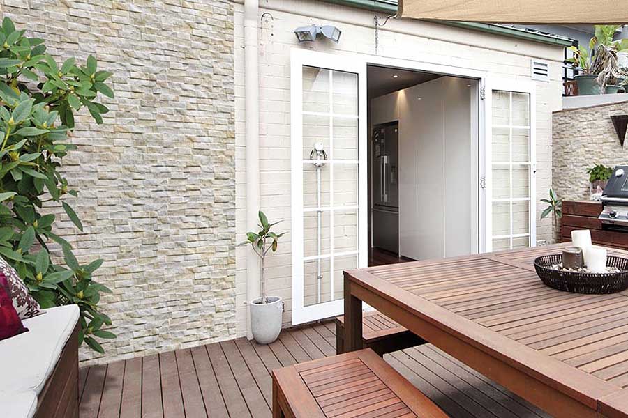 Pavestone white Rock Stack porcelain stone effect wall cladding applied to the exterior of a house