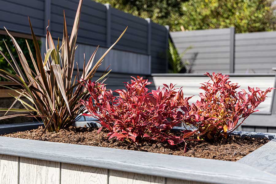 Raised patio planters made with wood effect cladding and decking