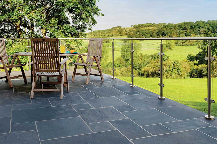 Raised Brazilian Slate patio with modern glass railings