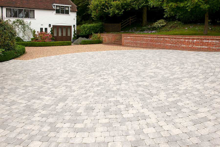 Large new block paved and gravel driveway