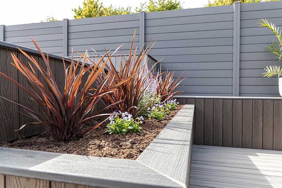 Smart grey composite fencing on display in the garden at AWBS Oxford