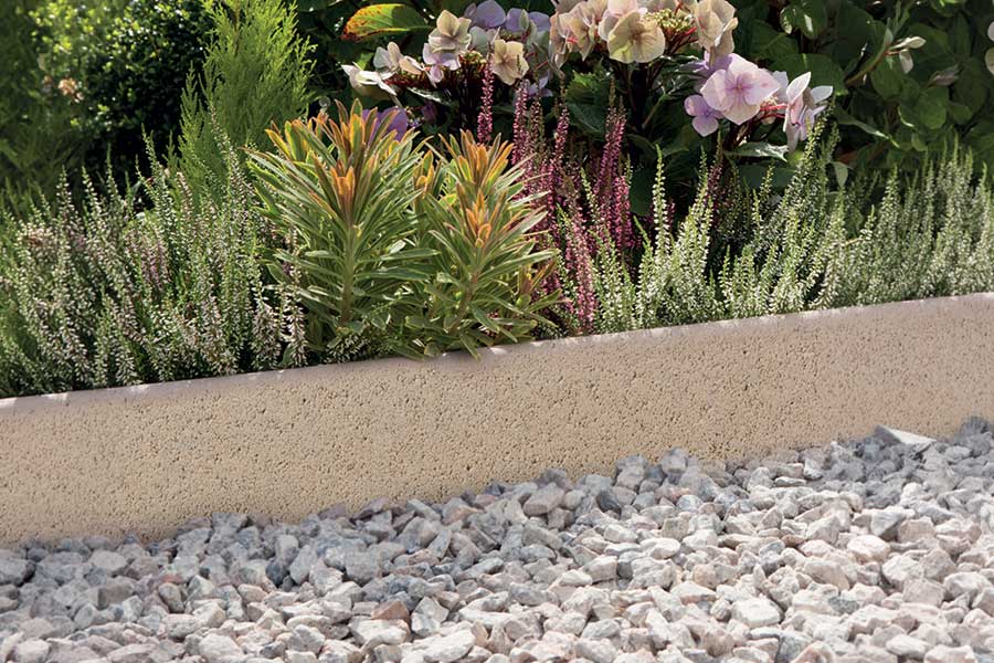 Classic round top stone edging used for a gravel garden path