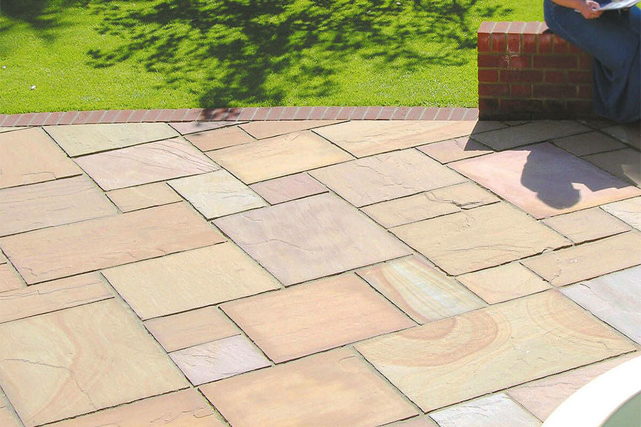 Smart new patio featuring Global Stone Buff Indian sandstone paving slabs