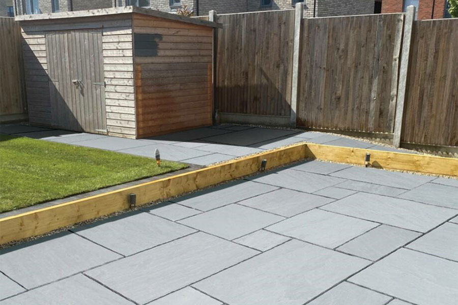 New patio featuring Global Stone 570 Series grey paving