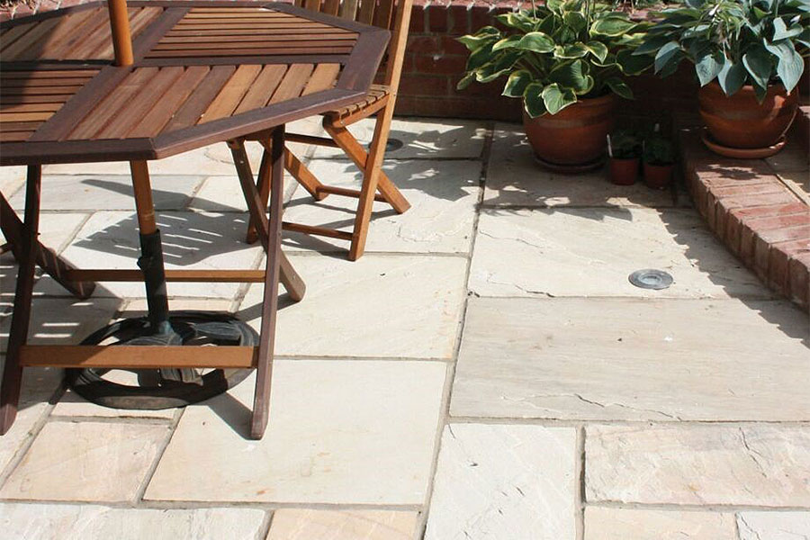 New patio featuring Global Stone 570 Series mint sandstone paving