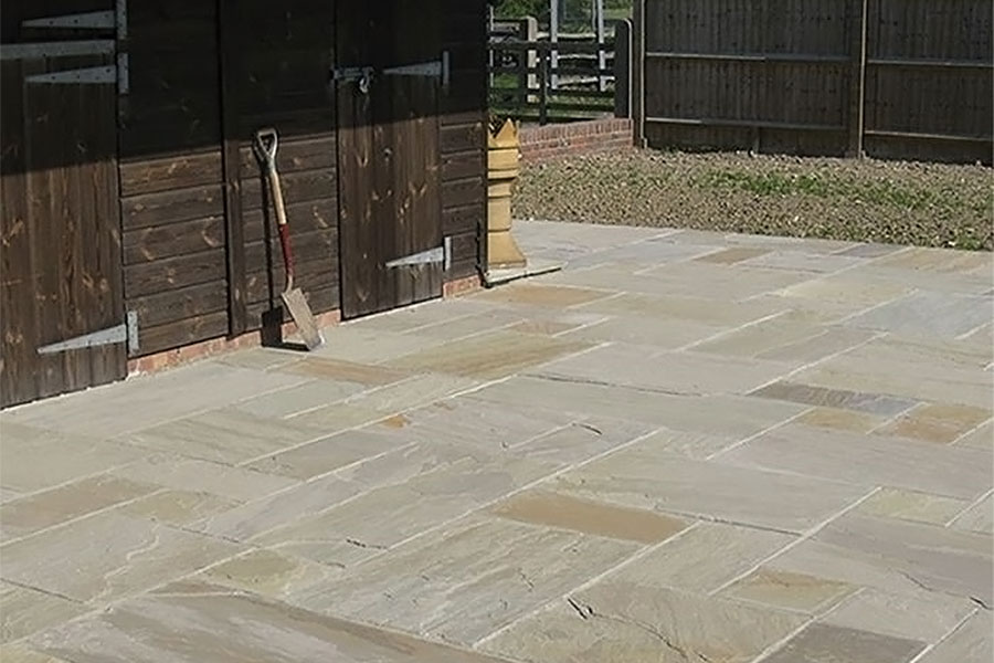 New patio featuring Global Stone 570 Series Raj Indian sandstone paving