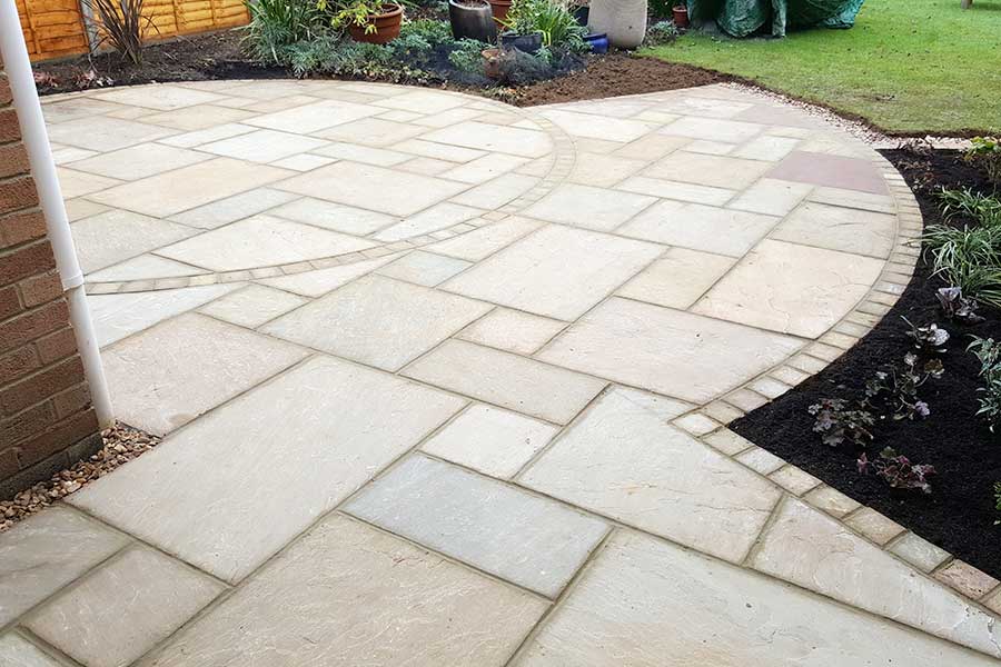 New patio featuring AWBS Exclusive Coastal Mix sandstone paving