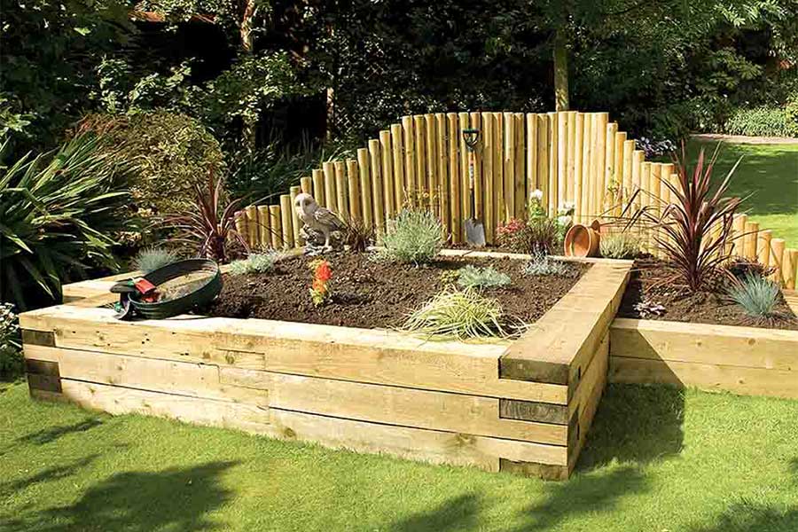 A large raised garden planter created with softwood sleepers