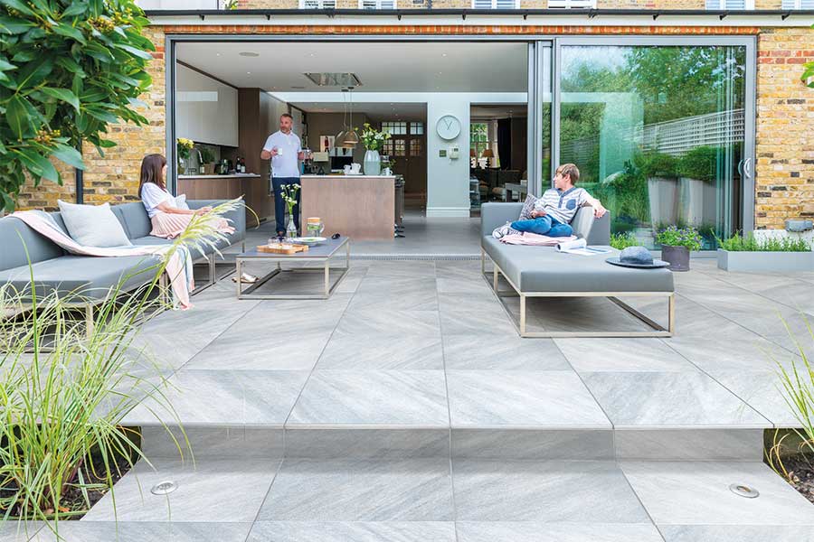 Tiered patio paved with Bradstone Mode stone effect porcelain paving slabs