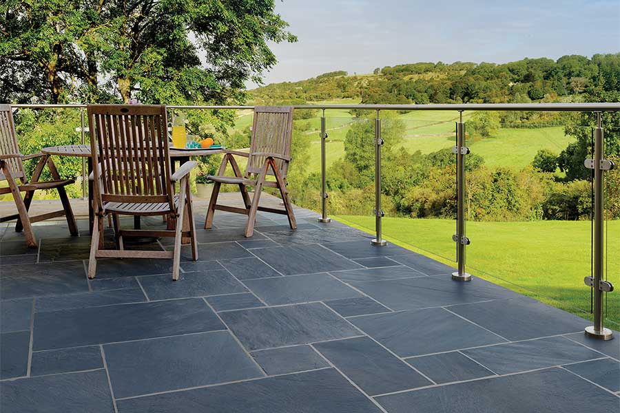 Large dark Brazilian slate paved patio