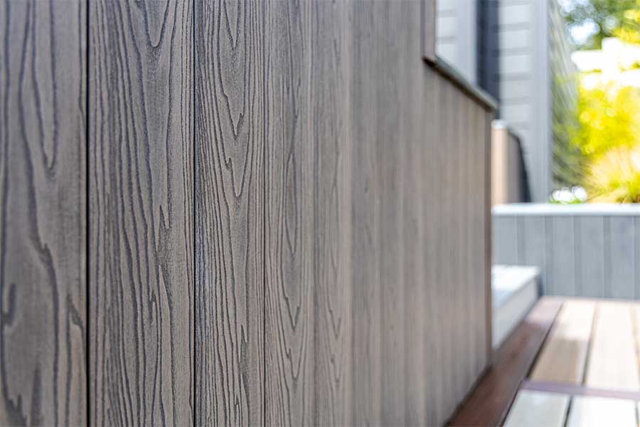 ArborClad amber colour wood effect composite cladding on display at AWBS in Oxford
