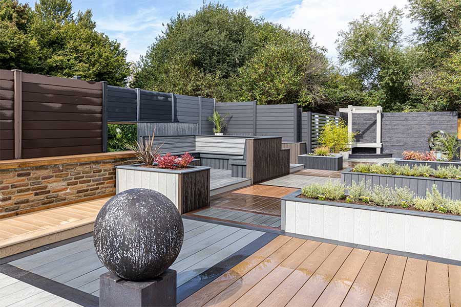 Large composite wood decking, cladding and fencing products display garden at AWBS in Oxford